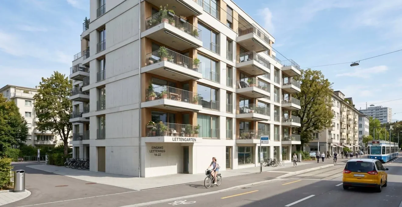Modernes Mehrfamilienhaus mit heller Fassade und Balkonen in städtischer Umgebung von Zürich bei Tageslicht